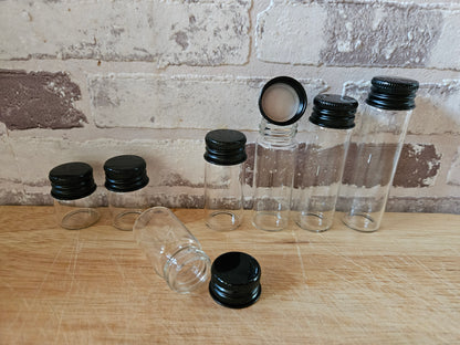 Mini glass bottle with aluminum screw cap in black