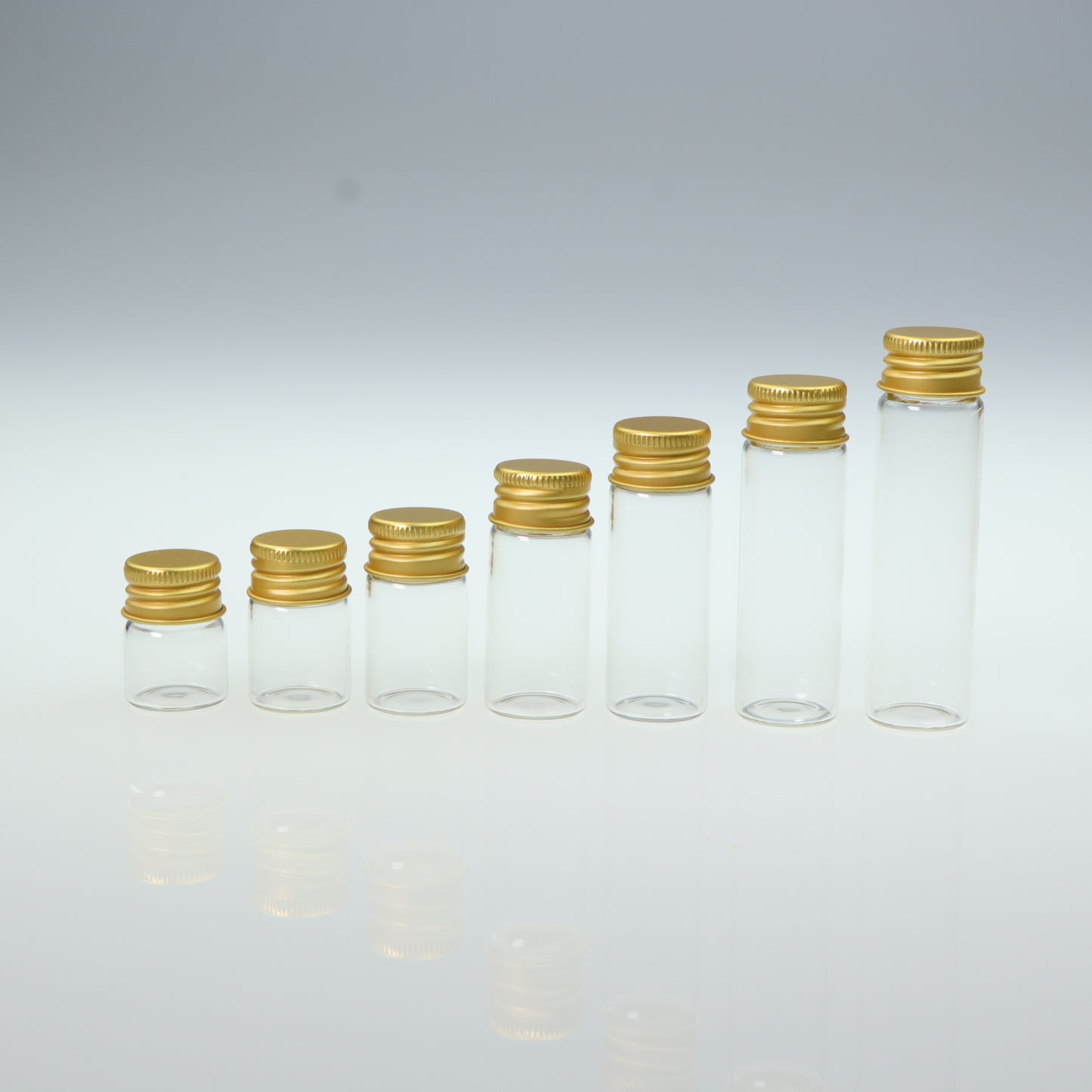 Mini glass bottle with aluminum screw cap in golden