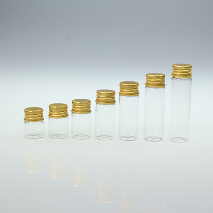 Mini glass bottle with aluminum screw cap in golden